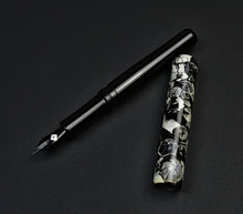 Load image into Gallery viewer, The Franklin-Christoph 40M Rush Hour Rain pen has a marbled black/white cap and sleek, dark body.