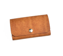Load image into Gallery viewer, Franklin-Christoph Business Card Case in brown Italian leather with gold snap, ideal for sleek organization.