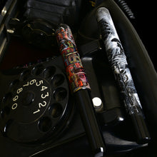 Load image into Gallery viewer, Two Franklin-Christoph 40M - A.A. Vacharat pens rest on a black rotary phone in Germantown, Philadelphia.