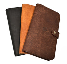 Load image into Gallery viewer, Three Franklin-Christoph ETN Italian Leathers journals, in black, tan, and brown (top: brown with button clasp), stacked.
