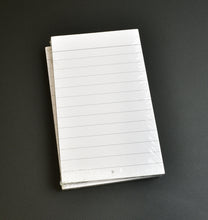 Load image into Gallery viewer, A wrapped stack of Franklin-Christoph 3x5 Index Cards, 50 Pack, with smooth acid-free paper on a dark surface.