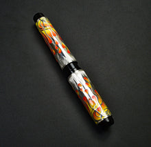 Load image into Gallery viewer, Franklin-Christoph Model 03M Fiamme di Christoph LE FP: Orange, yellow &amp; silver swirls on a dark pen.