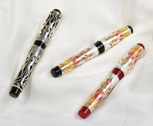 Load image into Gallery viewer, Three Franklin-Christoph Model 03M Fiamme di Christoph Limited Edition FPs rest on a white textured fabric background.