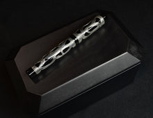 Load image into Gallery viewer, The Model 03M Fiori di Christoph LE FP by Franklin-Christoph rests on a sleek black rectangular box.