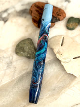 Load image into Gallery viewer, A Franklin-Christoph 46 A.A. Vacharat Kraken pen with octopus art lies on marble, amid shells and stones.