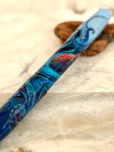 Load image into Gallery viewer, Franklin-Christoph Model 46 fountain pen. Original art by A.A. Vacharat. Kraken pen with swirling blue, red accent, on marble and wood surfaces.