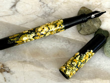Load image into Gallery viewer, Franklin-Christoph 03M A.A. Vacharat - Yellow Flower Fields pen, uncapped; floral design on marble with green stones.