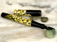 Load image into Gallery viewer, Franklin-Christoph 03M A.A. Vacharat - Yellow Flower Fields pen, uncapped on marble with cap and green stones nearby.