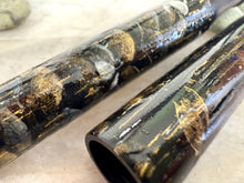 Load image into Gallery viewer, Two glossy black Franklin-Christoph 03M fountain pens featuring gold and white marbled Moonlight On Umbrellas patterns. Original art by AA Vacharat.