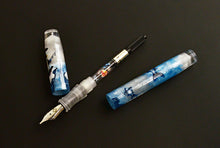 Load image into Gallery viewer, Franklin-Christoph 46 - A.A. Vacharat The Ice Fisher, uncapped in blue and white, shown on a black background.