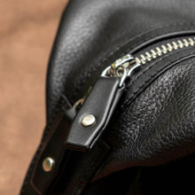 Load image into Gallery viewer, Franklin-Christoph Duffle Bag - Black Leather, features silver zipper and matching leather pull in a close-up view.