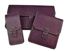 Load image into Gallery viewer, Three purple Franklin-Christoph Penvelope 3 cases in Italian vegetable-tanned leather with buckle closures.