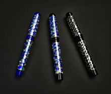 Load image into Gallery viewer, Three Model 03M Onde d’Acqua di Christoph FP pens are arranged diagonally on a plain black surface.