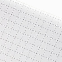 Load image into Gallery viewer, A 5.3 Pocket Notebook Refill from Franklin-Christoph, white pages with light gray grids, shown at an angle.