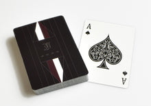Load image into Gallery viewer, Franklin-Christoph Napa Leather Playing Card Case with cards, ace of spades face up, on a white background.