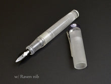 Load image into Gallery viewer, Franklin-Christoph Model 20p Fountain Pen - Smoke &amp; Ice: clear slip cap off, black Raven nib on black background.