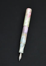 Load image into Gallery viewer, pocket 45 Opal acrylic fountain pen with base white in pearlescent colors. One pen with cap posted on a dark background. Onyx acrylic finials on each end.
