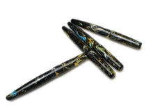 Load image into Gallery viewer, Four Franklin-Christoph Pocket 66 FP SE - Into the Void Brass pens feature marbled black, gold, and blue acrylic accents.