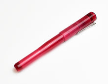 Load image into Gallery viewer, The Franklin-Christoph Model 02 Intrinsic Ruby pen with silver clip lies diagonally on a white background.