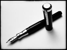 Load image into Gallery viewer, The Franklin-Christoph Model 02 Intrinsic FP - Black &amp; Aluminum, cap off, rests on a white acrylic surface.