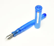 Load image into Gallery viewer, A Franklin-Christoph Model 02 Intrinsic Fountain Pen in Maya Blue with a #6 nib rests uncapped on a white surface.