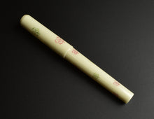 Load image into Gallery viewer, Franklin-Christoph Model 03 FP in Pistachio with 4 Leaf Olive Red, shown diagonally on a black background.