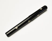 Load image into Gallery viewer, Franklin-Christoph Model 03 Four Leaf Clover pen with platinum dust on white, featuring small white flower designs.