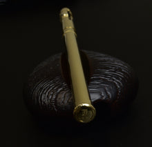 Load image into Gallery viewer, A Solid Gold 18K Pencil Extender by Franklin-Christoph rests on a black background.