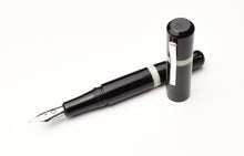 Load image into Gallery viewer, Franklin-Christoph Model 19 Fountain Pen in Black &amp; Creme, durable acrylic, #6 silver nib, capped; on white background.