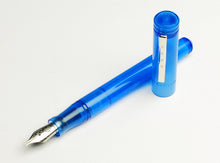 Load image into Gallery viewer, A Maya Blue Franklin-Christoph Model 20 Marietta fountain pen with its cap rests on a white background.