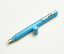 Load image into Gallery viewer, Franklin-Christoph Model 25 Eclipse Fountain Pen in Sky Blue SE, featuring a metal clip and round protrusion on cap.