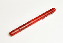 Load image into Gallery viewer, A Franklin-Christoph Model 25 Eclipse Venetian Red fountain pen rests diagonally on a plain white background.