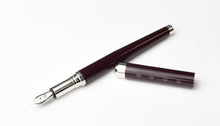 Load image into Gallery viewer, The Franklin-Christoph Model 28 Libertas Fountain Pen in dark purple with silver nib rests on a white background.