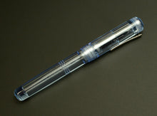 Load image into Gallery viewer, Franklin-Christoph Model 31 Omnis Fountain Pen - Arctic Ice SE with silver clip on a dark gray background.
