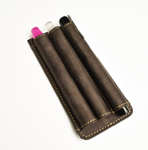 Load image into Gallery viewer, Franklin-Christoph Pen Case Inserts: brown leather, modular, 3 slots, holds pink, white &amp; black pens on white background.
