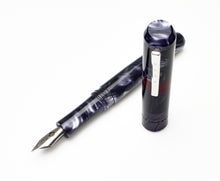 Load image into Gallery viewer, A Franklin-Christoph Model 40 Panther Fountain Pen in Smoke &amp; Maroon with #6 nib lies uncapped on a white background.