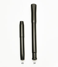 Load image into Gallery viewer, Two Franklin-Christoph Model 50 Grandis fountain pen caps in solid black stand side by side on white.