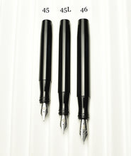 Load image into Gallery viewer, Three Franklin-Christoph fountain pens are vertically lined up for size comparison on a white textured background.