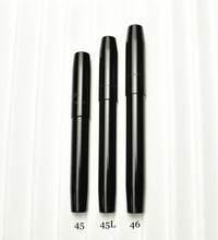 Load image into Gallery viewer, Three Franklin-Christoph fountain pens—models 45, 45L, and 46—stand upright for comparison on a ridged surface.