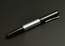 Load image into Gallery viewer, A Franklin-Christoph Model 55 Pentium FP - Black &amp; Aluminum rests on a dark background.