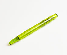 Load image into Gallery viewer, A translucent green Franklin-Christoph Model 65 Stabilis - Olivae SE pen rests diagonally on a white background.