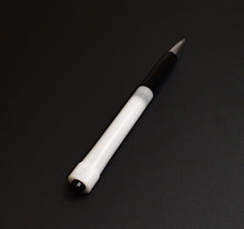 Load image into Gallery viewer, The Franklin-Christoph Model 90 Artium Pencil - Black White evokes an artist’s touch on a plain black background.
