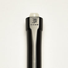 Load image into Gallery viewer, Close-up of the Franklin-Christoph Model 90 Artium Pencil - Black &amp; Creme’, showing its top with an engraved old English letter A and four small diamond shapes, and a visible white click button tip above.
