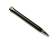 Load image into Gallery viewer, A stylish black and crème’ Model 90 Artium Pencil by Franklin-Christoph, featuring a silver tip reminiscent of an artist’s pencil, is placed diagonally on a plain white background.