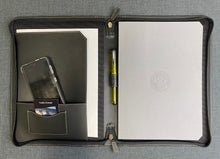 Load image into Gallery viewer, Franklin-Christoph A4 Zippered Padfolio - Seconds open with notebook, pen, phone &amp; cards in pockets on gray surface.