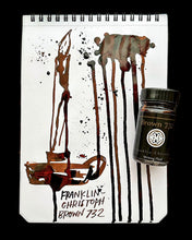 Load image into Gallery viewer, Notepad with ink art of a pen, splatters, and a Franklin-Christoph Bottled Ink on the page.