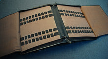 Load image into Gallery viewer, Franklin-Christoph 40 Pen Case - Black Napa Seconds, open with elastic slots for organized pen or supply storage.