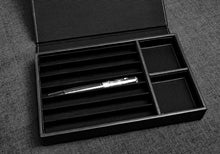Load image into Gallery viewer, Open Franklin-Christoph Covered Pen Tray with a single pen inside, displayed on a textured grey surface.