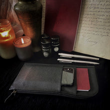Load image into Gallery viewer, Dark desk with candles, metal vase, vintage script, pens &amp; Franklin-Christoph EDC Travel Wallet in black leather.