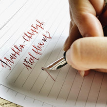 Load image into Gallery viewer, Writing with the Franklin-Christoph #6 Nib Unit and red ink on lined paper using a quality fountain pen.